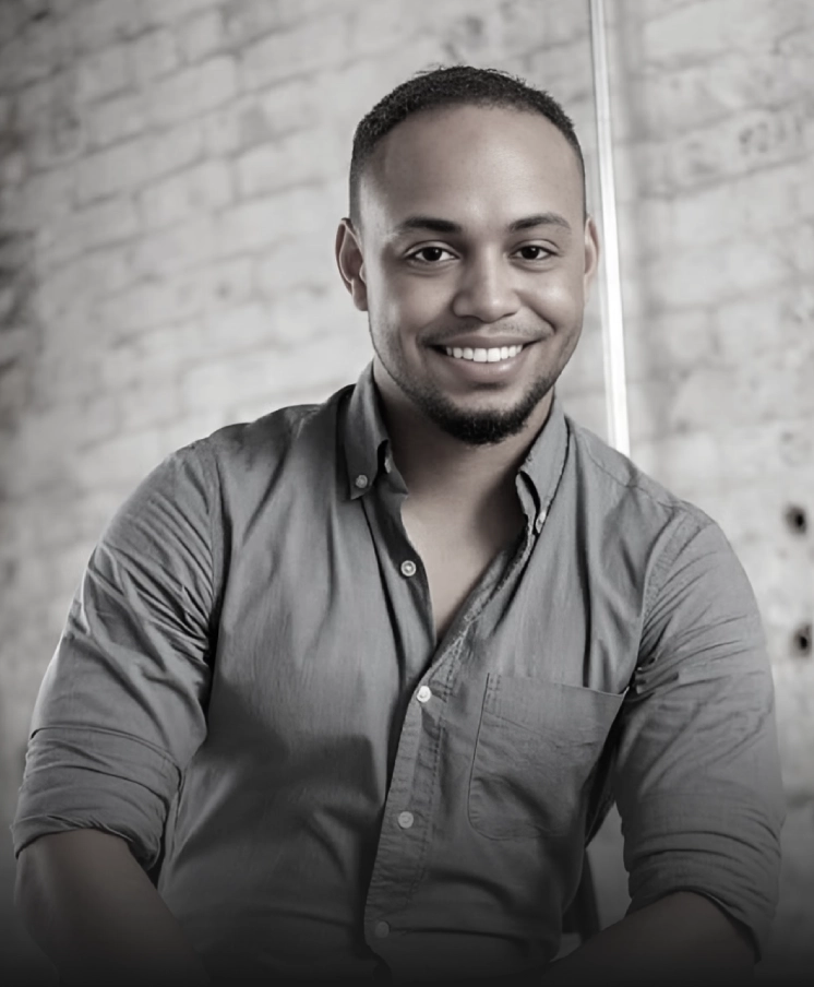 Black-and-white portrait of a smiling man