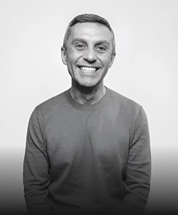 Black-and-white portrait of a smiling man