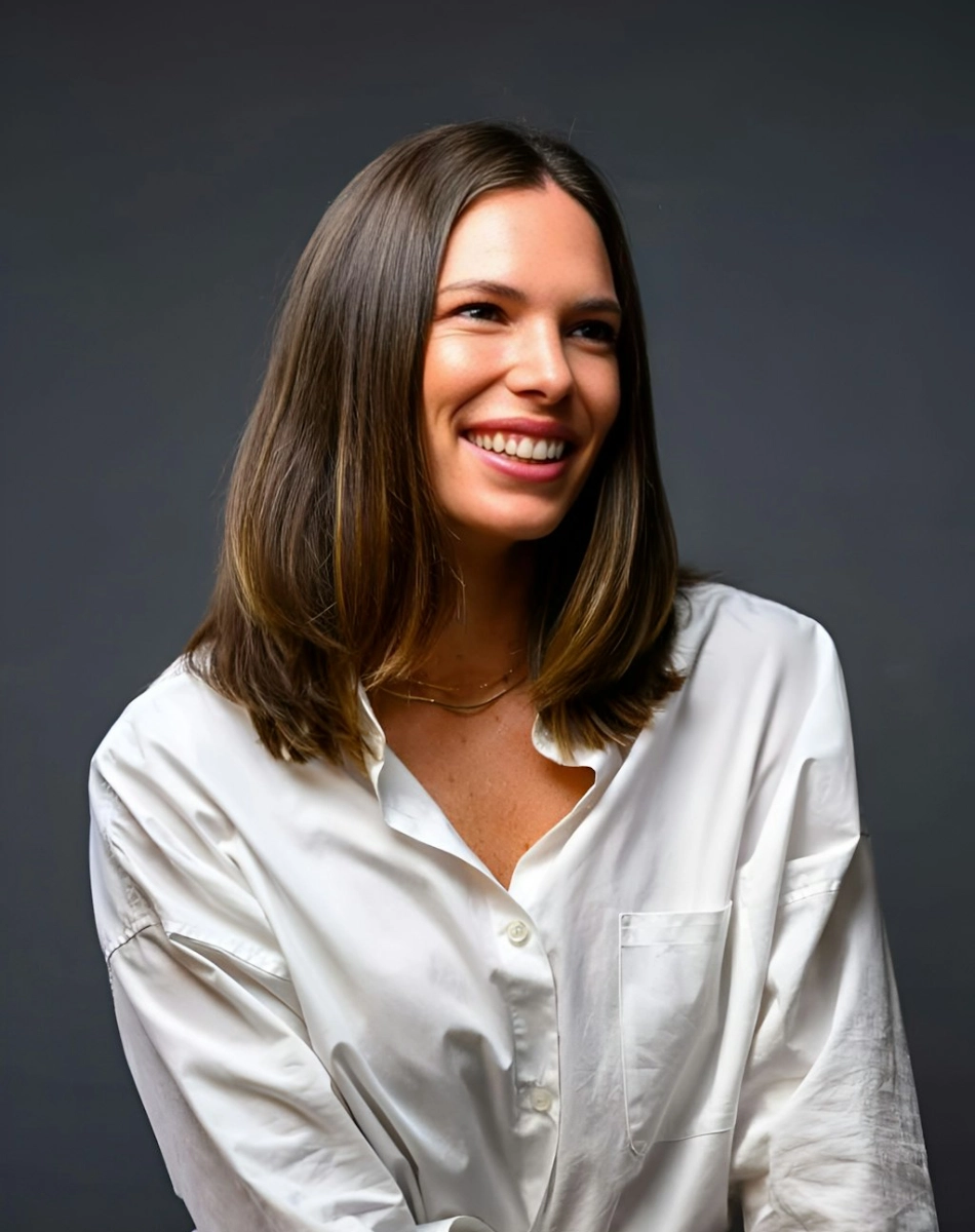 Woman in white tshirt posing in front of camera