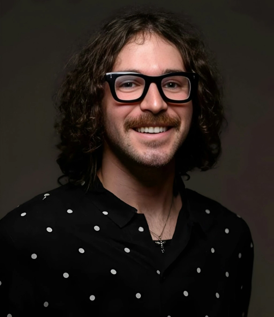 Portrait of a smiling man with curly hair