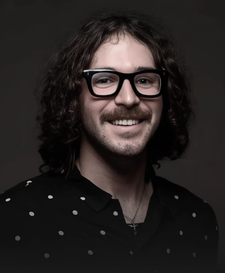 Person with long hair Smiling and Looking at the caera